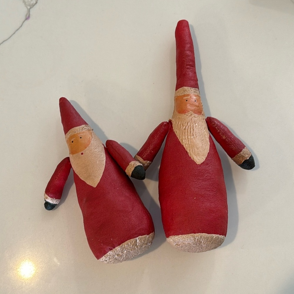 Two Santa Clause Figurines